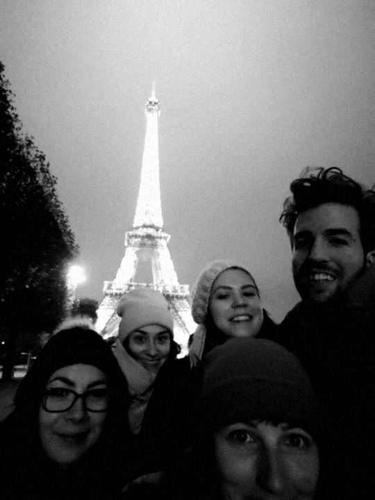 Collegues in Paris in front of the Eiffel tower.