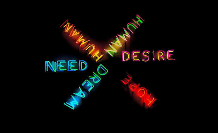Business value of design: human, desire, hope written in neon letters